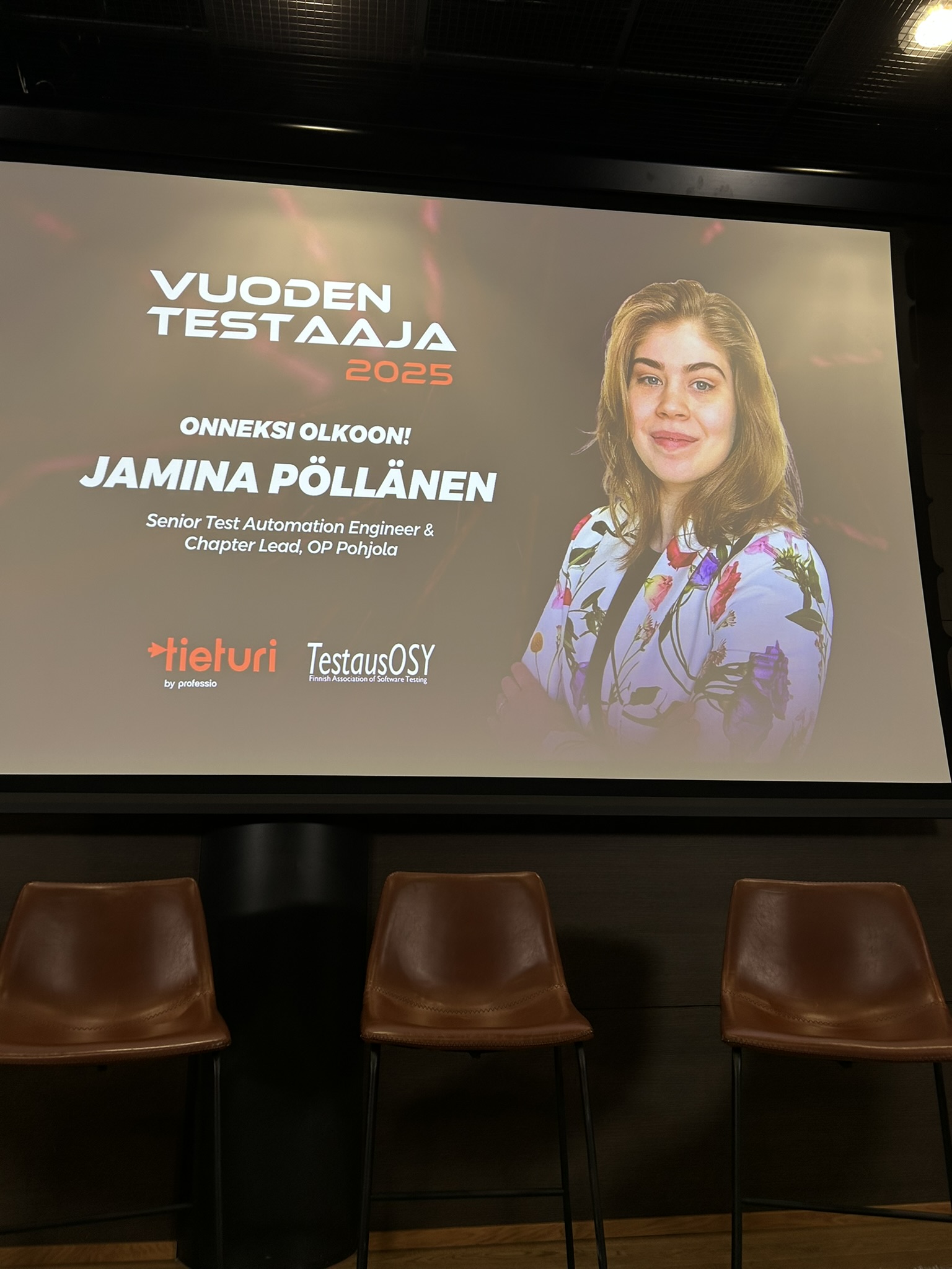 Announcement of Jamina Pöllänen as the Tester of the Year 2025 in the event \"Testaus ja AI 2026\" Picture of announcing the tester of the year 2025